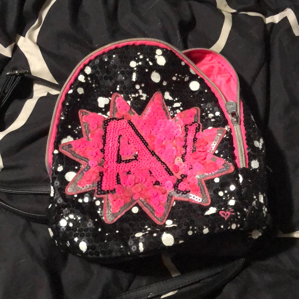 Justice mini boogie bag with an “a”